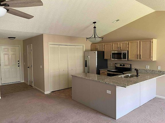 Fully Equipped Kitchen with new floors, new granite countertops, all new appliances, disposal and built-in microwave oven.