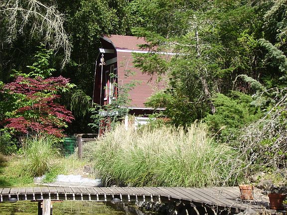 Footbridge over pond w/barnview