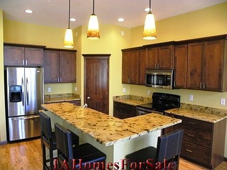 Kitchen with granite counter tops and knotty alder cupboards