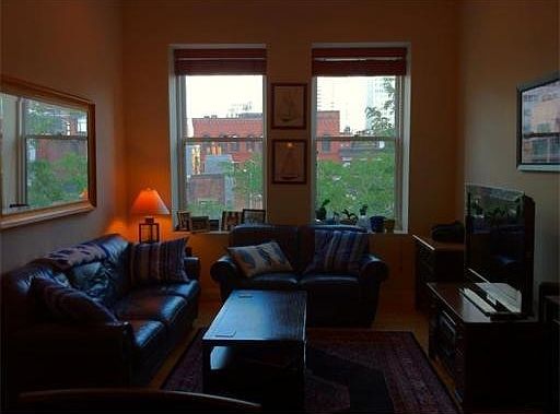 Living Room w/ large windows & high ceilings