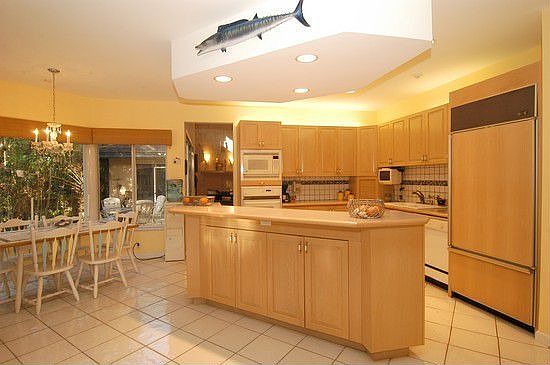 Subzero & Monogram appliances in Kitchen w/ adjacent Breakfast Bay