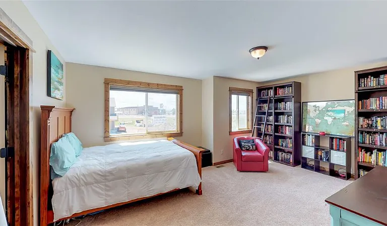 Large bookcases to house your collection. Cozy up on a chair by the window and enjoy your reading.