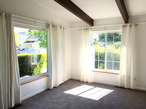 Sunny, open living room with high ceilings. Spacious closets in living and bedroom.