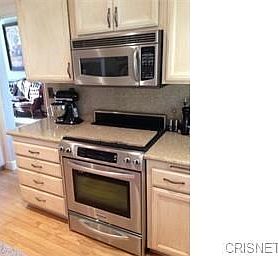 Remodeled kitchen includes stainless steel appliances
