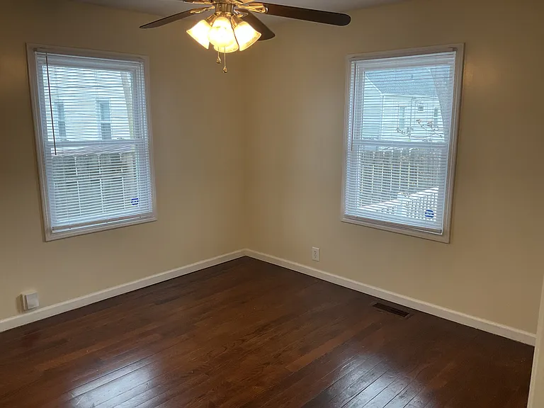 Large Main Floor Bedroom with Ceiling Fan.