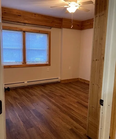 Back bedroom with large windows towards the back yard