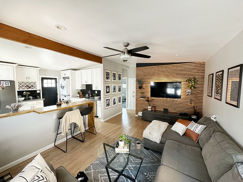 Open-concept living room with a custom-built kitchen peninsula and a seamless flow between spaces
