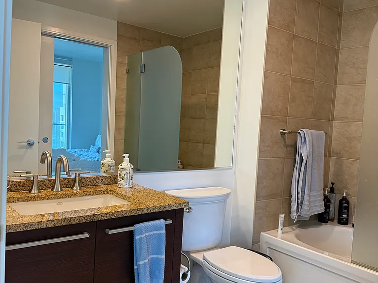 Spacious bathroom with new toilet and bathroom fittings