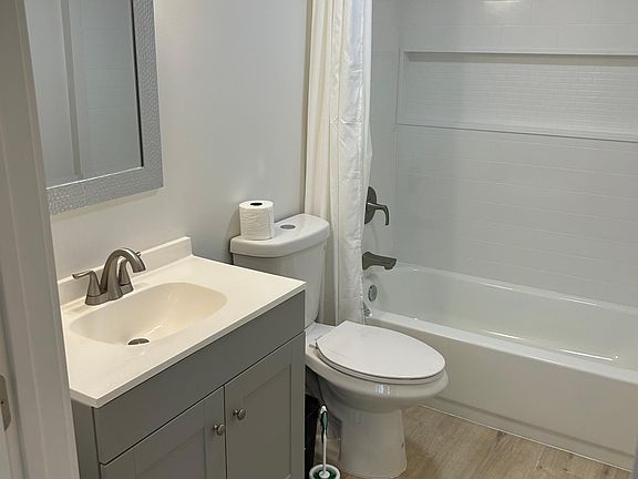 Full bath with tub and shower.