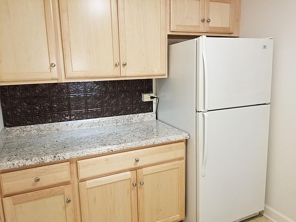 North Wall of Kitchen - New Maple Cabinets, Counter Top and Backsplash.