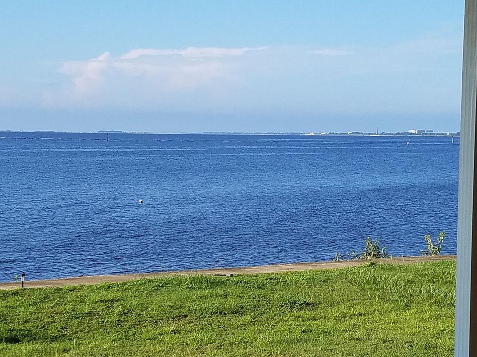 Backyard. View includes 3-mile bridge, Blue Wahoos Stadium,