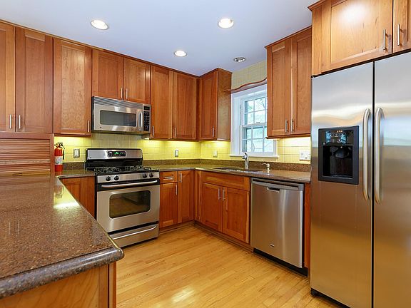 High quality kitchen includes granite countertops.