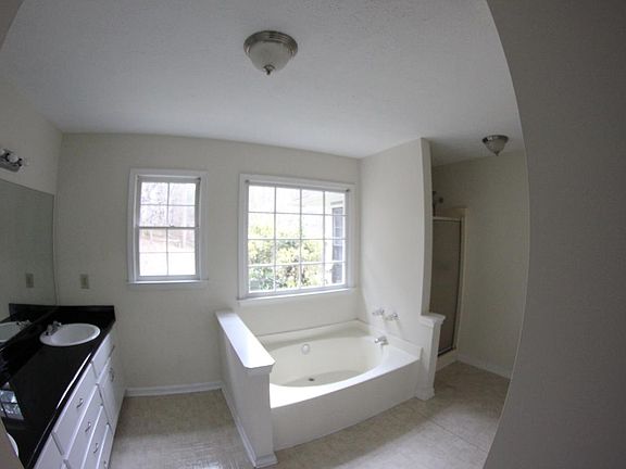 master bathroom with seperate tub and shower