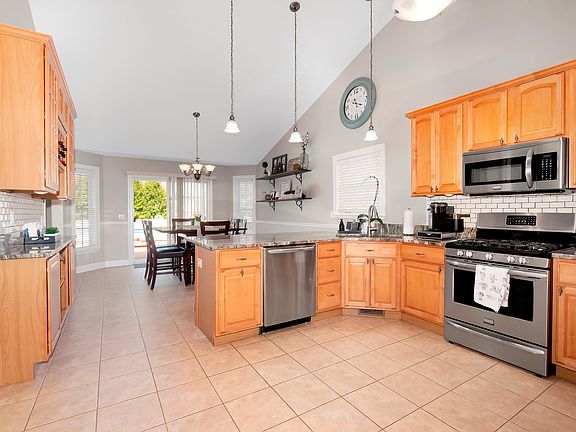 Entertain easily with the side buffet and countertop bar seating.
