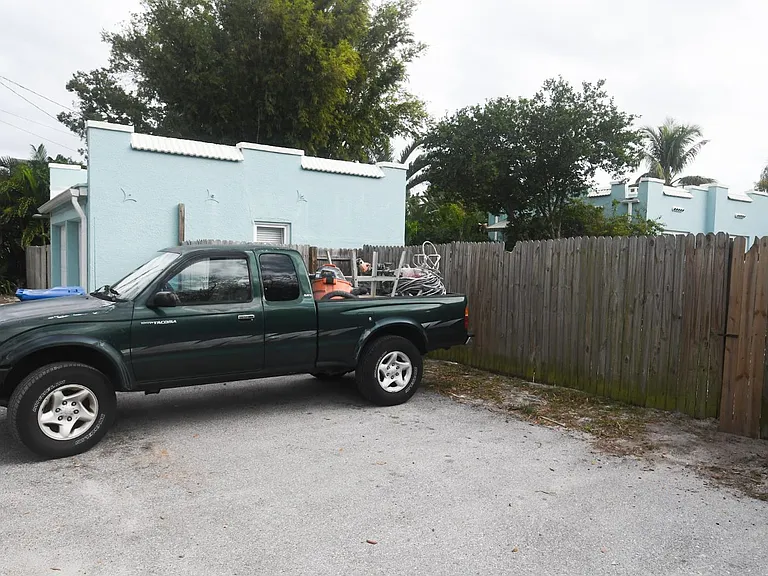 Two off-street parking places in the rear, big enough for large trucks. Enter the backyard through the gate.