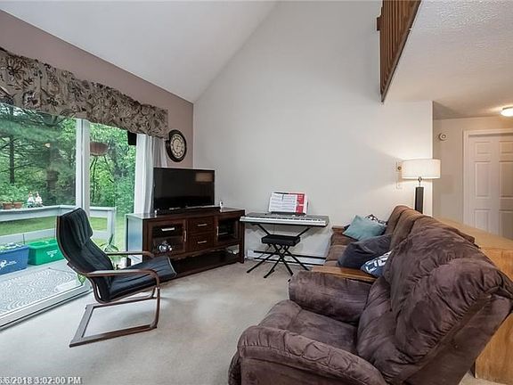Living room showing door to first floor bath.