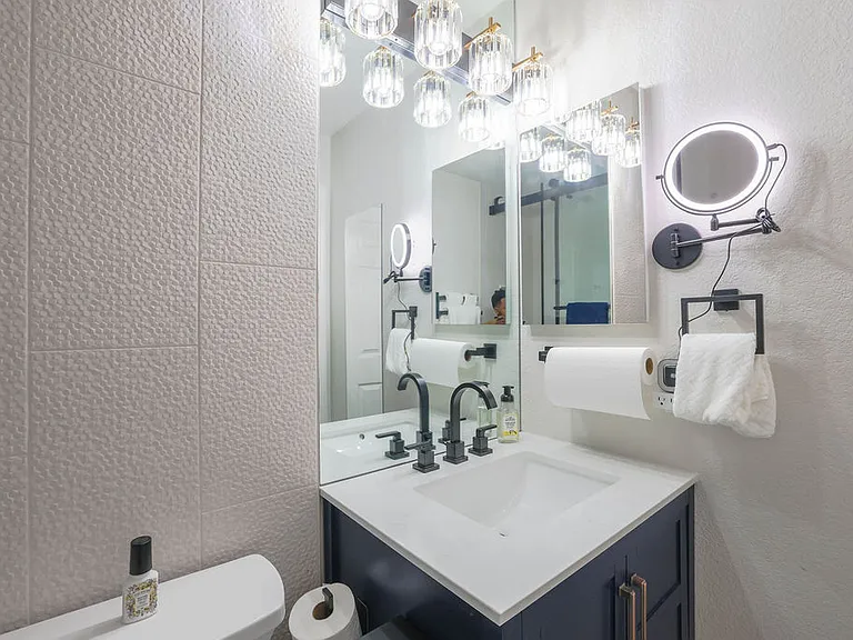 Main hall bath with tub, rain shower head, hand held shower, cabinet, medicine cabinet, 10x magnifying mirror, towels for 2, safety grab bars