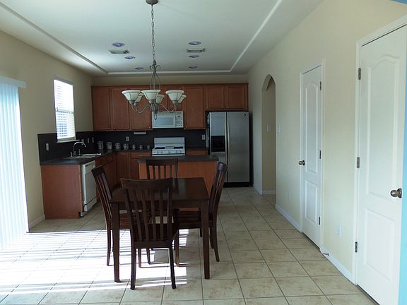 The family room is open to this dining room and kitchen.