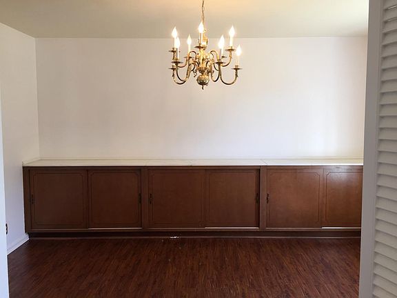 formal dining room with chandelier