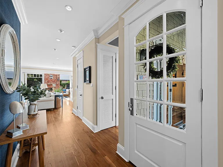Entryway with grass cloth wallcovering