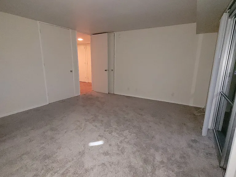Downstairs Bedroom 2 facing doorway entrance