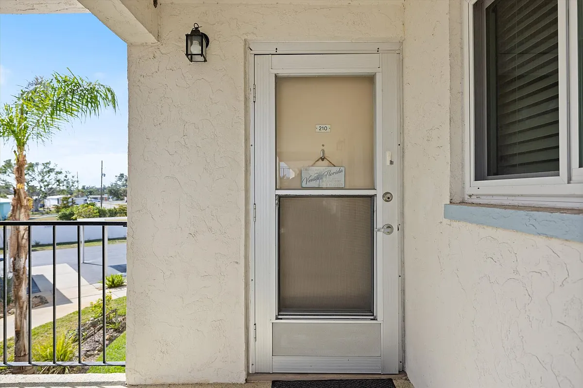 Building Photo - 708 Tamiami Trl S #210