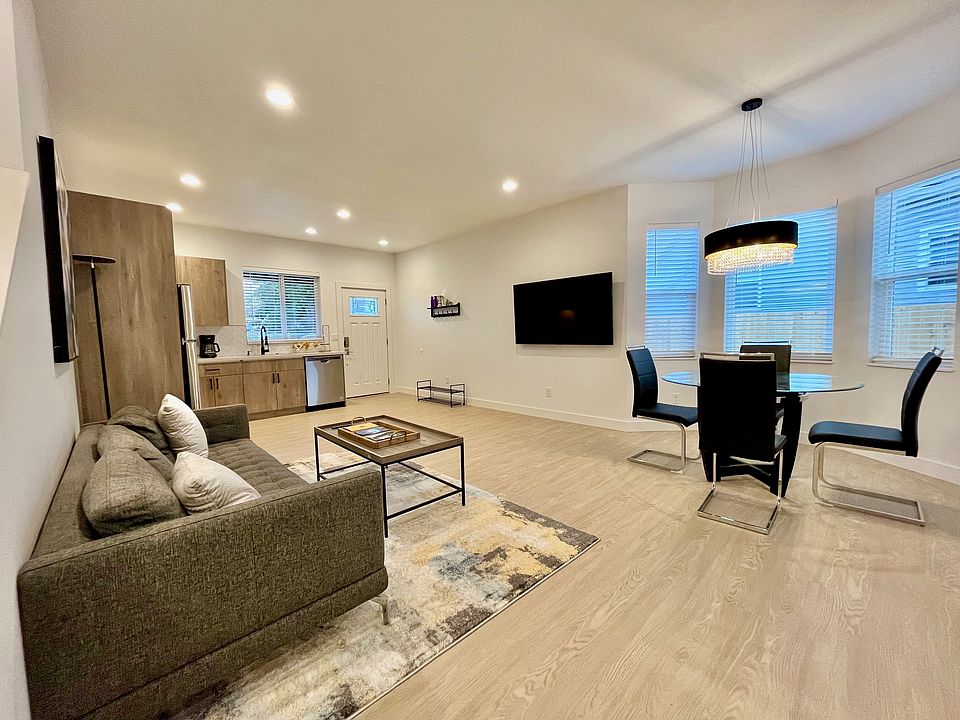 Entertain, dine, and cook in style _ all in one harmonious open area.