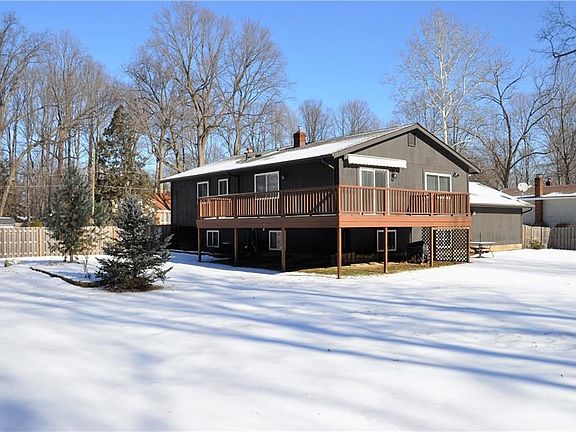 Wrap-around deck overlooks the large, fenced in backyard.