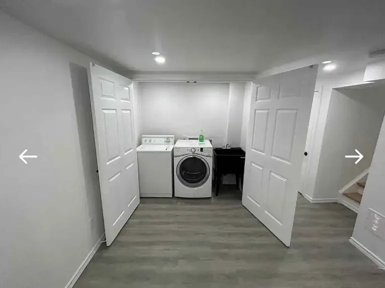 laundry room, a dryer and washer, air vent in the room