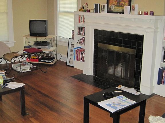 Living room with fireplace and built-in bookshelves
