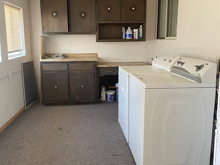 Laundry room with washer and dryer included