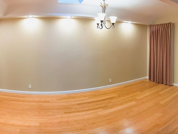 Separate dinning room with sky light, can fit 12 chair dinning table.