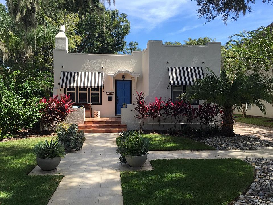 Exterior with professional landscaping and new walkways.