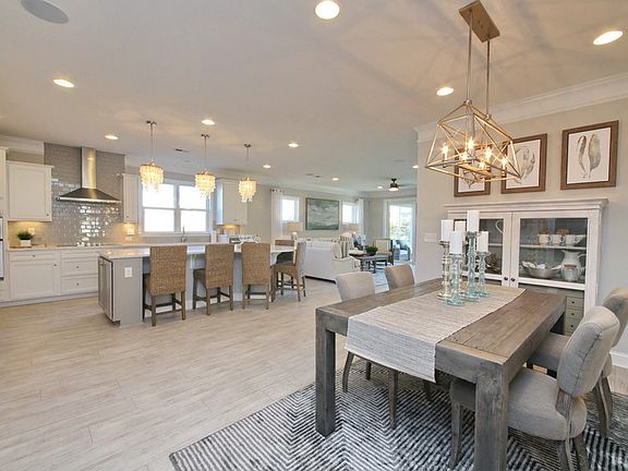 New home design with an open floorplan perfect for gathering- Model Representation