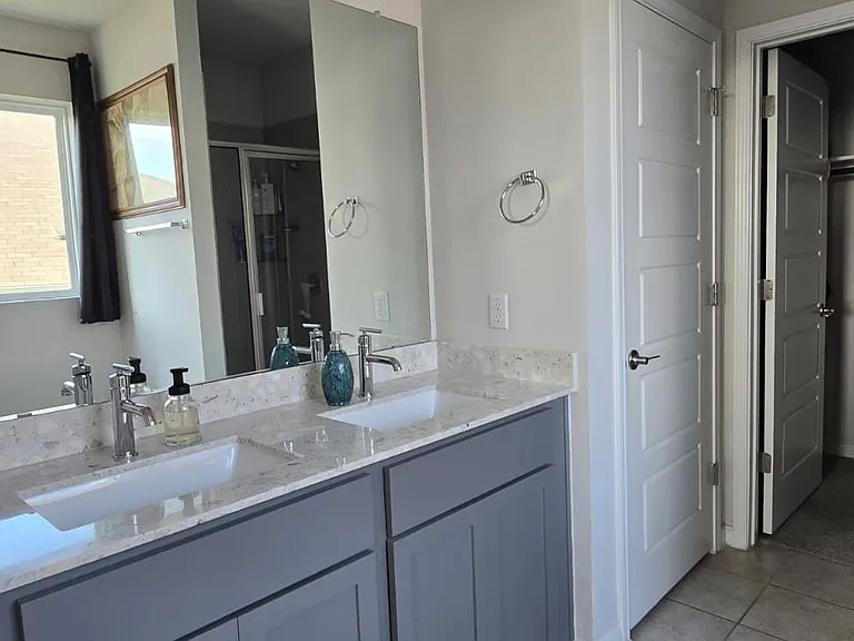 Dual vanity, quartz counters, walk-in closet.