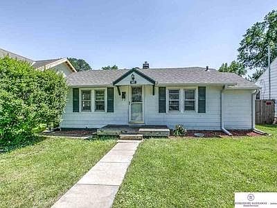 Front of home - in summer prior to new siding and windows