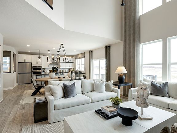 Standing in the Gathering Room, looking in the dining room and kitchen