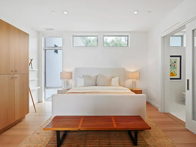 Each bedroom boasts luxurious bedding and sophisticated decor for an unparalleled sleep experience.