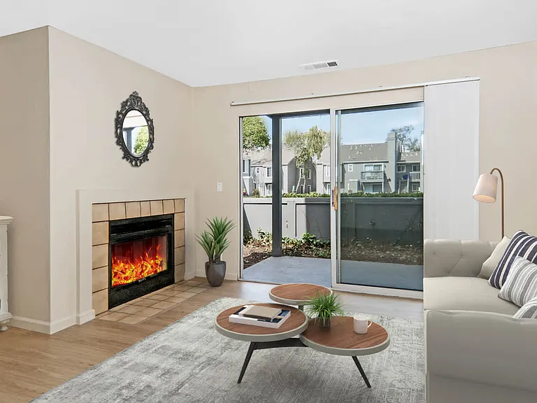 Living Room with Hard Surface Flooring, Fireplace and Patio