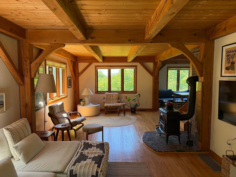 Cozy post and beam design with wood stove