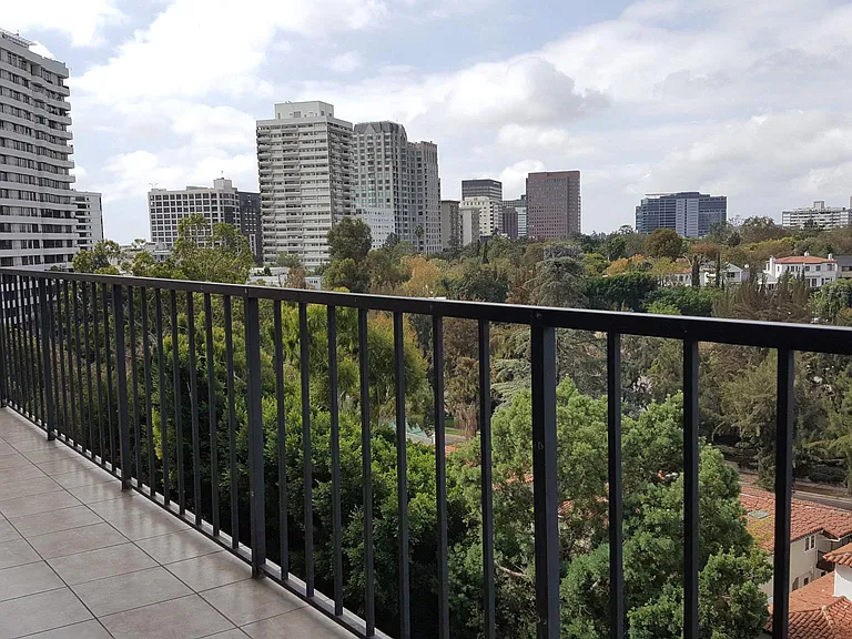 Large balcony facing Holmby Hills and Bel Air, offering peaceful, unobstructed views