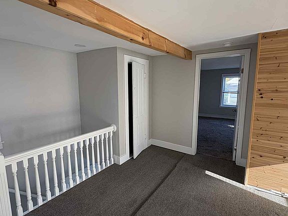 Living room looking at Master bedroom and stairs down to front porch