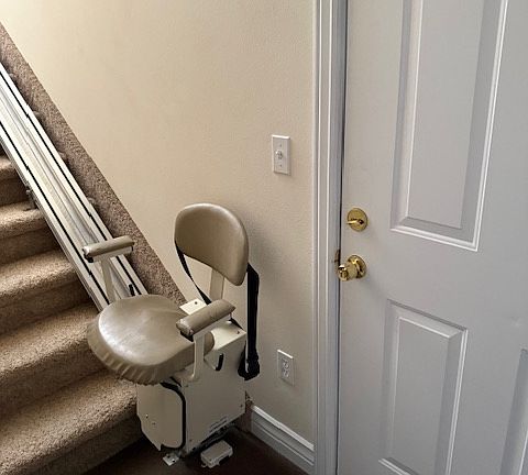 Entry and staircase. chair works and is handy to haul things upstairs.