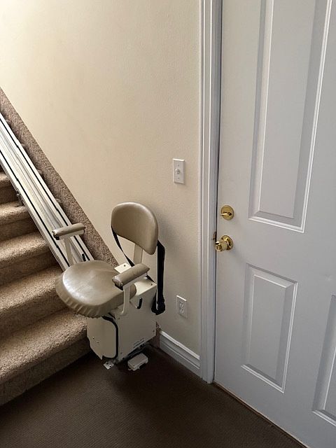 Entry and staircase. chair works and is handy to haul things upstairs.