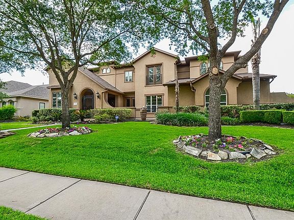 Another view of this wonderful home! This property has plenty of yard space for children or pets to play and also has mature trees for great shade during a hot day!
