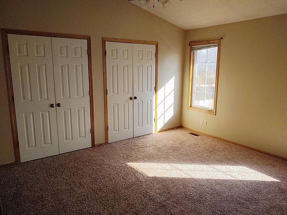 Master bedroom with vaulted ceiling and large closet