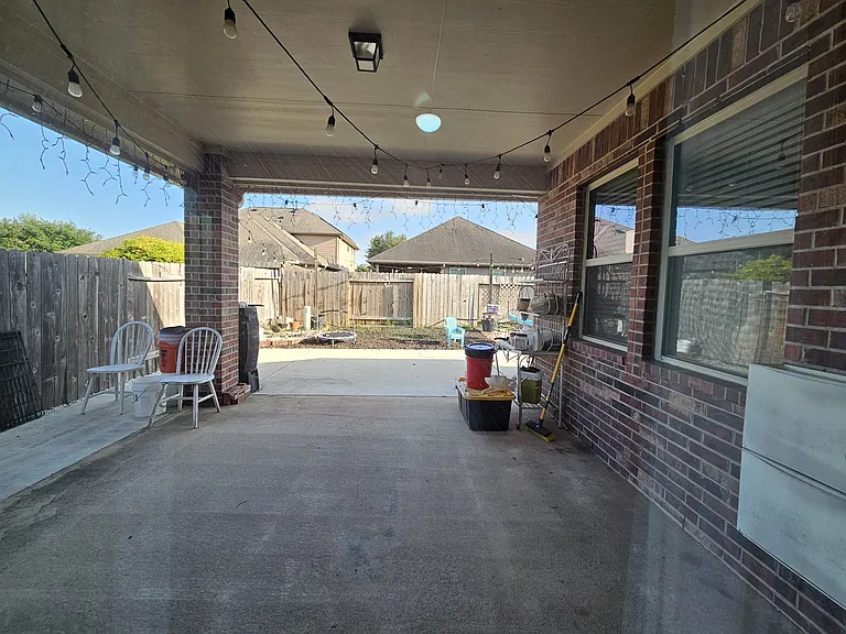 Back patio with additional concrete slab added.