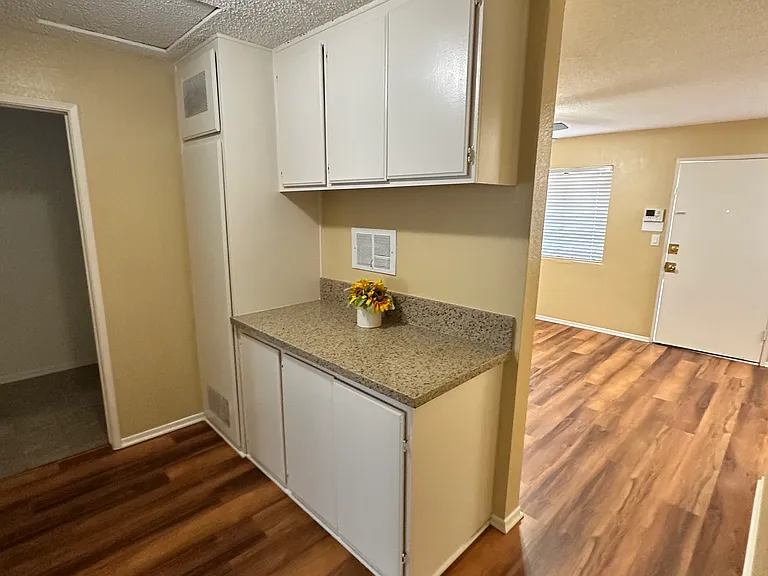 Hallway with linen cabinets