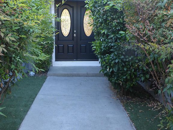 Double front doors with leaded glass inserts.