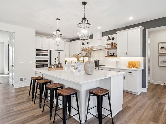 Kitchen with pendant lights over island